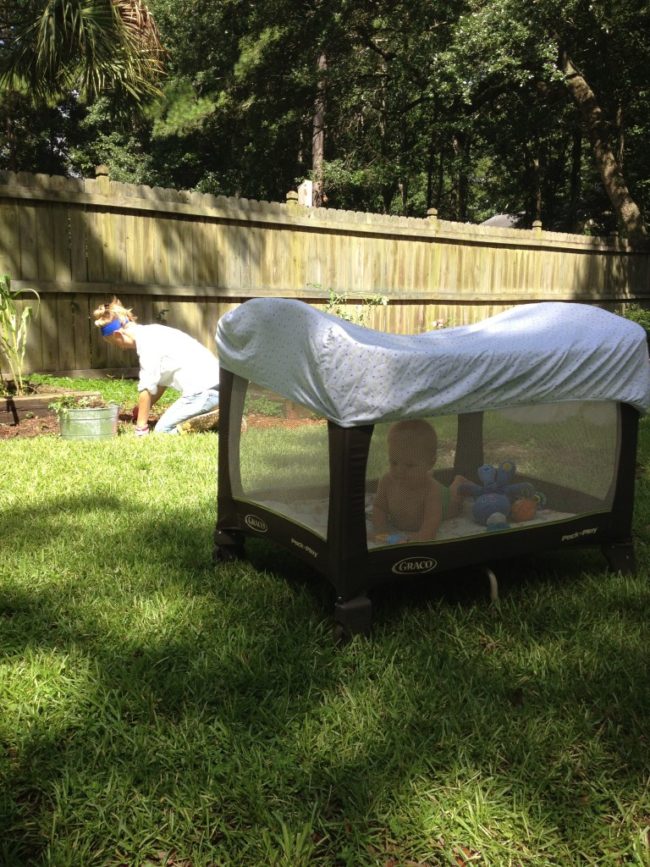 Protect your child from bug bites by placing a crib sheet over their pack 'n play.