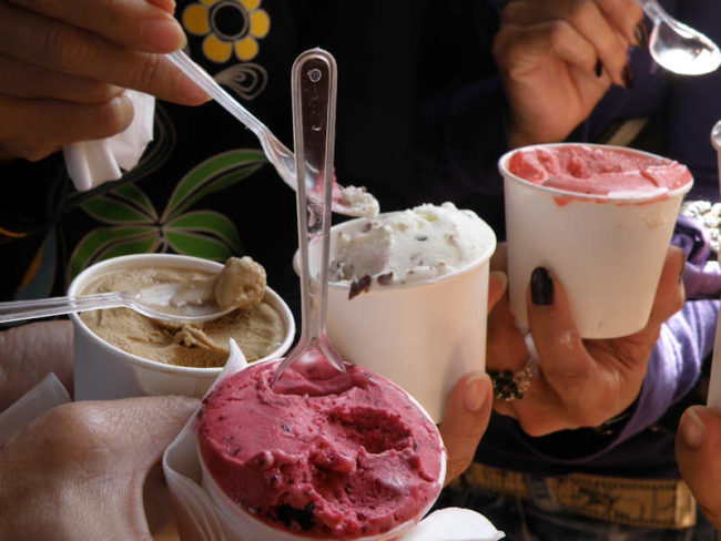 Put ice cream pints in Ziploc bags before they go in the freezer. When you take them out, the ice cream will be soft and scoopable.