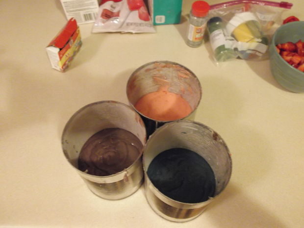 Fill the tin cans with one color per can, making sure to not fill them more than 2/3 of the way since cake rises. Bake them in the oven just like you would with a normal cake.