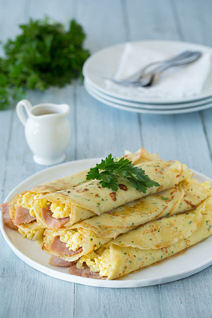 Herb crepes with eggs, Swiss, ham, and browned butter are a wonderfully tasty way to start your day.