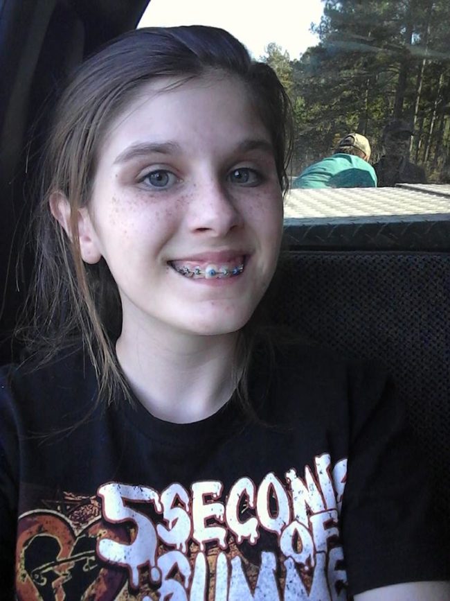 You can see her brother, Kolton, bending over in the background, but Haley can't explain the figure right next to him.