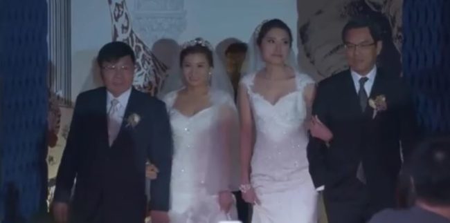 John Li, CEO of HSBC Bank in Taiwan, where Jennifer is employed, offered his arm to her in place of her father.She was worried about the way she'd be treated at work, but her coworkers completely accepted her and came to celebrate with her as well!