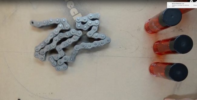 Each of the four bottles would end up being spaced out equally and attached to the link chain.