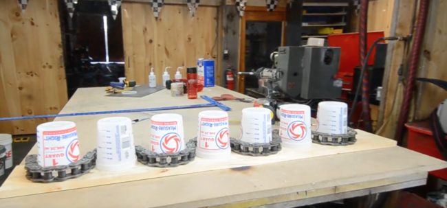 He wanted to create a wave effect, so he wrapped the chain around a few one-quart paint buckets that were glued down on a wooden board.