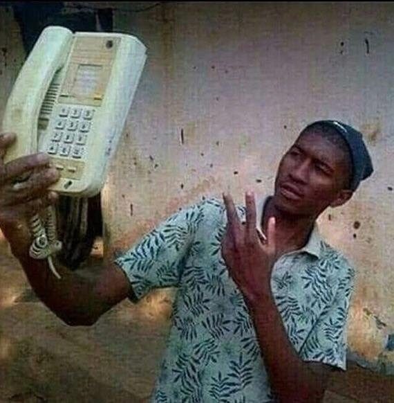 His phone isn't smart and neither is he, but that won't stop him from trying to take a selfie.