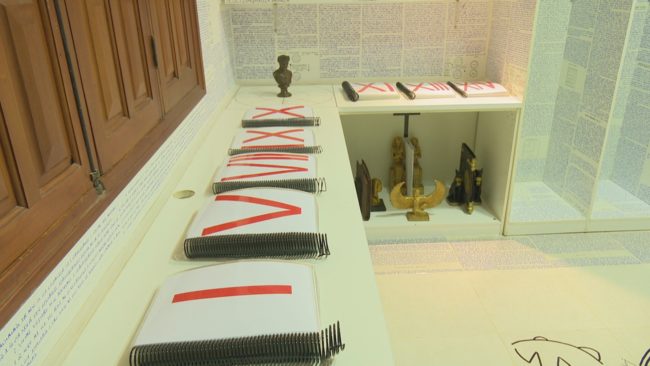 After getting the police involved, his family opened the room.That's where they found encrypted language and symbols all over the walls along with 14 handwritten books that couldn't be deciphered either.