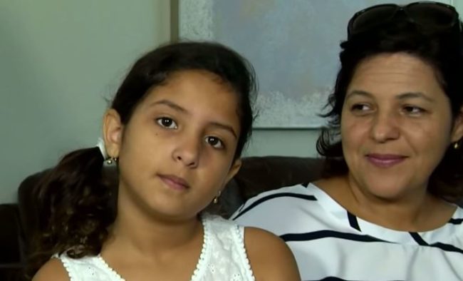 She tried hitting the gator at first, but says it refused to budge.