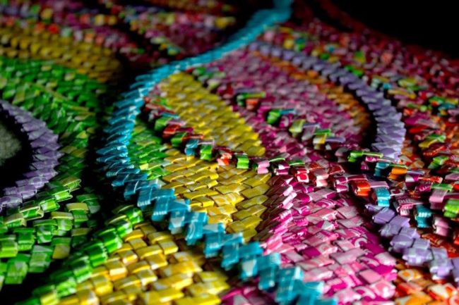 That's when she started folding, creating long chains of single and multi-color wrappers. 
