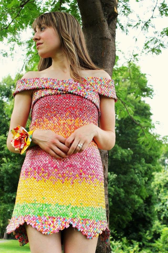 The dress is totally beautiful. No one would even be able to tell that it's made of candy wrappers!