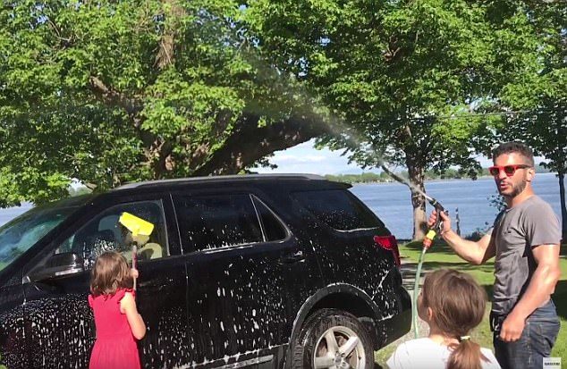 To prove that nothing out of the ordinary was happening, he first sprays a stream of water above the car.