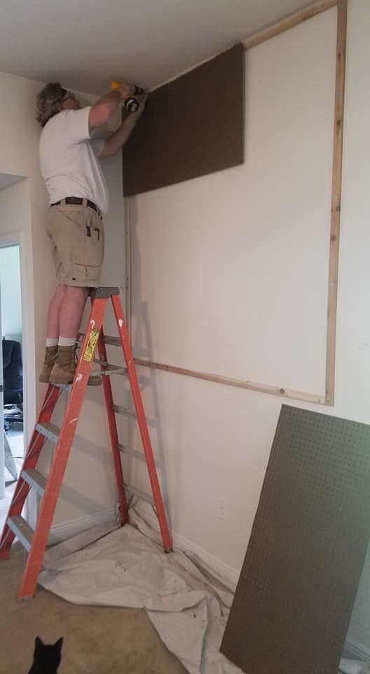 Dad began the project by installing a series of frames equipped with furring strips.