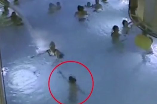 The kid reached out to a passing swimmer, but she just kept moving despite appearing to look directly at him.