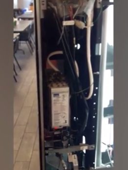 A closer look revealed that there was indeed a snake coiled up inside the machine.