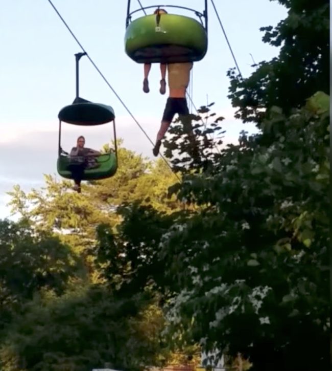 Below she can be seen hanging on for dear life as her brother fearfully shouts out for someone to come save the day.