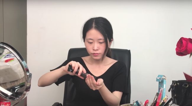 She walks around the office and starts to gather some special ingredients from her coworkers.