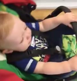 Their baby boy was so cranky. He just needed a nap, but they still had some shopping to do.