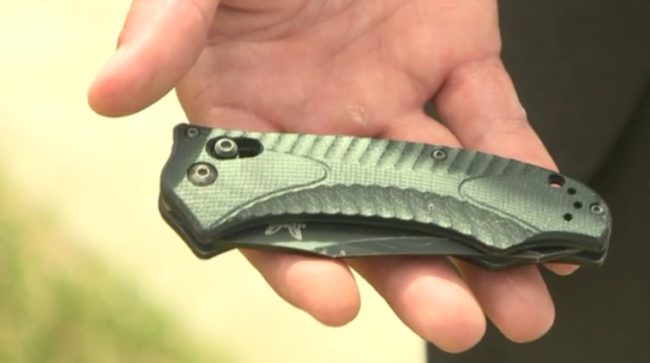 Greb was able to hand her a pocketknife through the smashed driver's side window. She successfully cut herself loose but still couldn't get out of the vehicle.