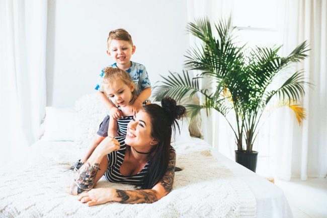 Maybe it's because she has two kids of her own, but the sounds didn't bother Bernard. What did bother her, however, was the woman sitting in front of the little girl. After the three-year-old kicked her seat, the woman reached behind her and actually grabbed the child's leg.