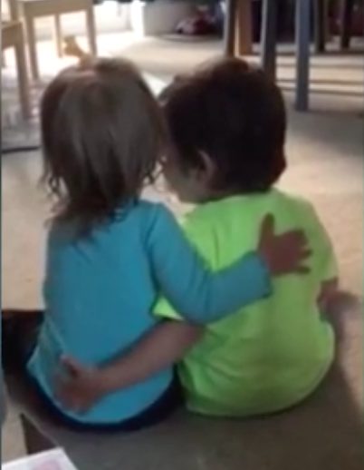 Once she realizes something is wrong, she reaches out to hug and kiss him to make him feel better. 