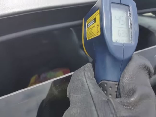 Using a tool to check the temperature inside the truck, the officer knew he had to step in and save the day.