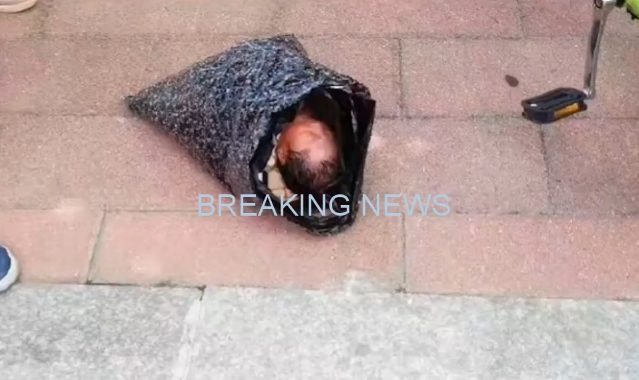 The infant is reportedly in a stable condition at a hospital in the city, while Luo is under police investigation for suspected child abandonment.