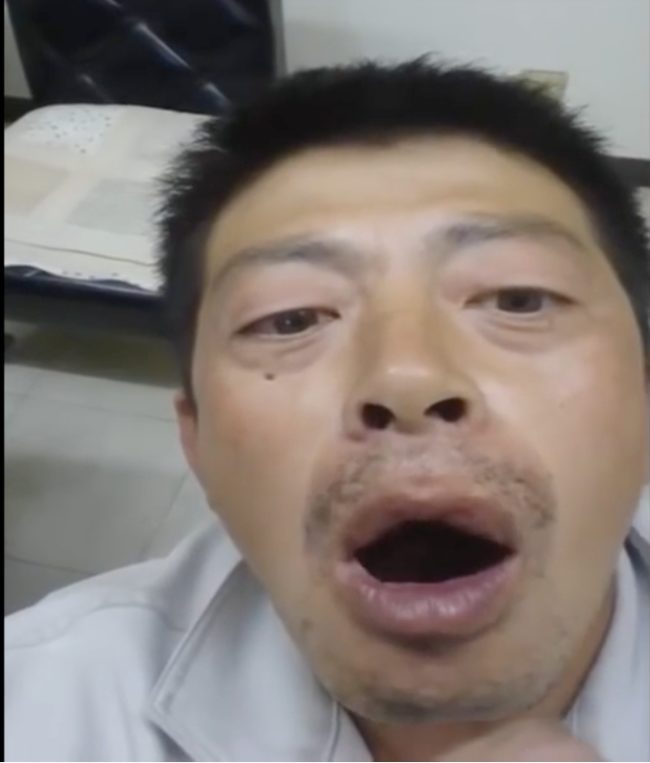 At first it seems like the man is just serving face for the cameras.