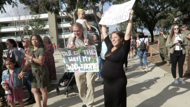 Holding a sign declaring, “Not a drill. Baby’s coming,” Katrina embraced her husband before preparing to head to the hospital.