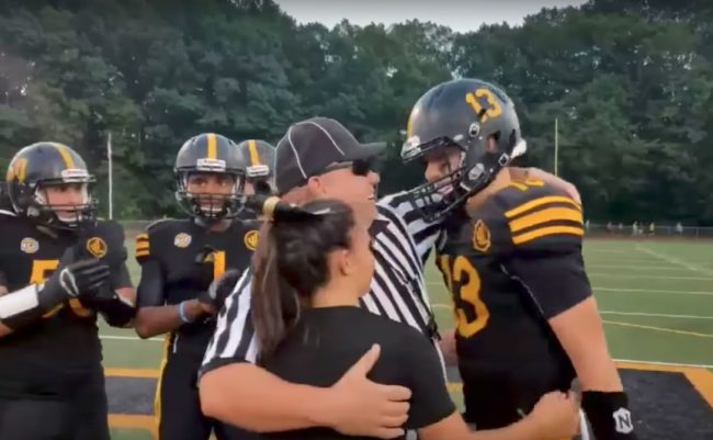 His daughter, Olivia, is a cheerleader. She was also on the field and came running over.