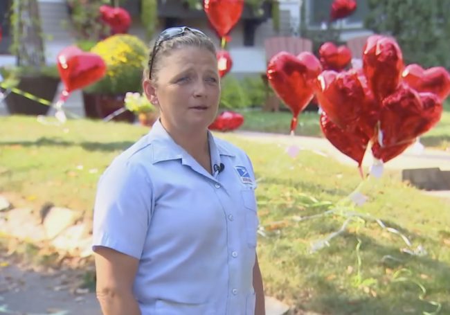 The balloons were part of a special surprise set in place by her neighbors and orchestrated by their local mail carrier, Michele Slack.
