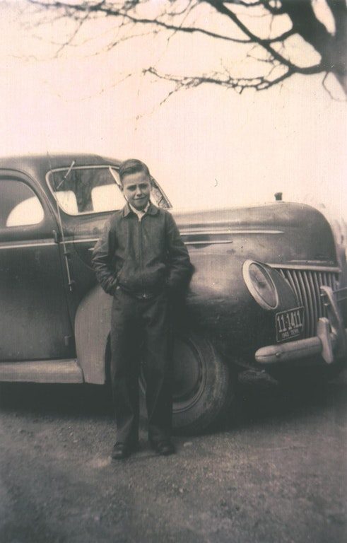 "My dad's first car, a 1939 Ford. He bought it with his own money that he earned farming (and drove it daily). He was 11 when he bought it, so this photo was taken in 1948."