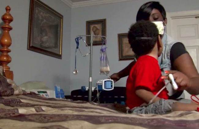 They supposedly want to ensure he's on "good behavior" before performing the procedure, but his son is in pain. The logic doesn't quite line up.