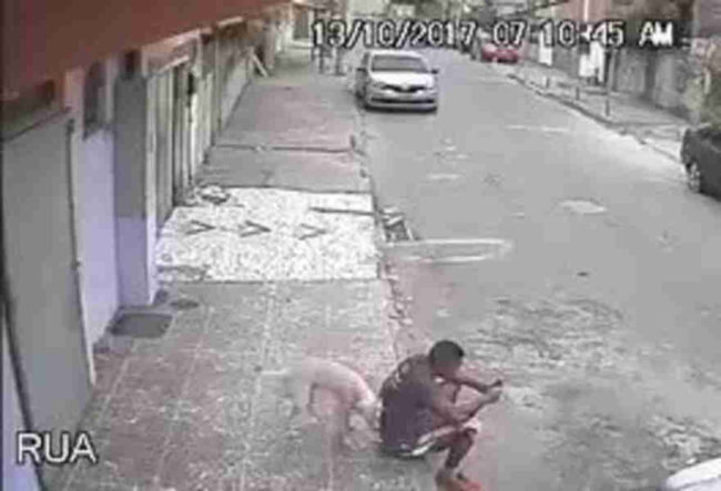 Heinze Sanchez was sitting on his phone when the pup walked up, sniffed him, and peed on his back. 