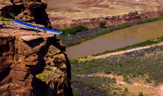 In what he's calling his biggest stunt yet, Graham set up a giant slip n' slide right at the edge of a 500-foot cliff.
