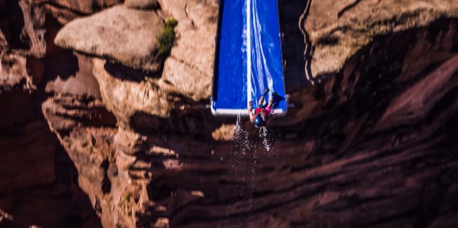 Armed with the proper gear and parachutes, these guys had no fear jumping on the slide and hurling down toward the ground below.