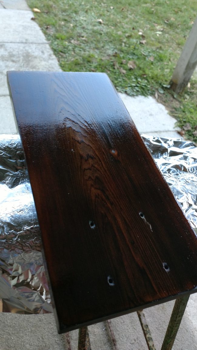 After taking a blow torch to the wood for some added flare, he finished off the wooden base with some boiled linseed oil and a wax coat.