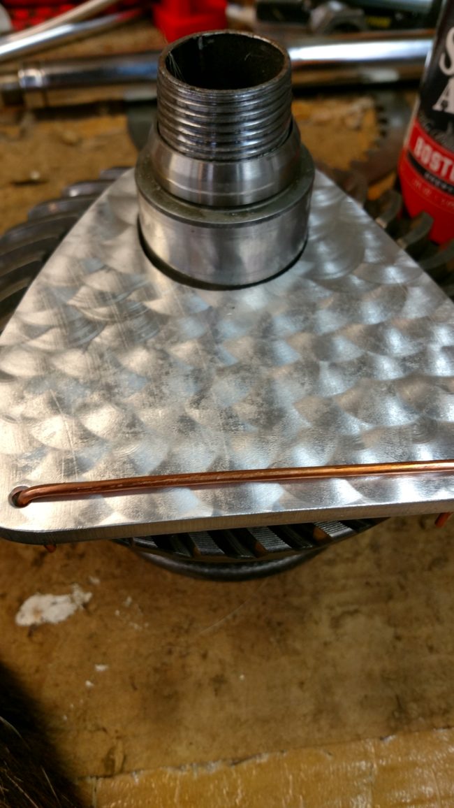 Next he attached a small strip of copper wire to the plate to prevent his phone from falling off the charging station.