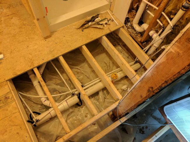 Before the bathroom flooring could be put in, all the plumbing had to be installed and checked by an inspector.