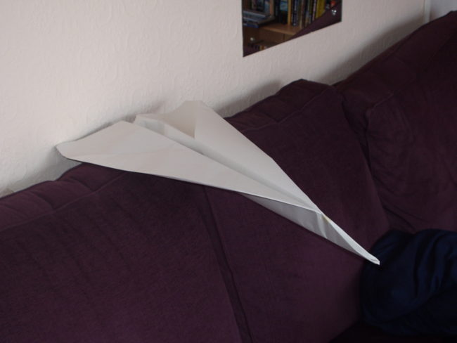 "The class was an applied math course for high schoolers, and we held a paper airplane design contest. The rule was that you could use anything on the table to make your airplane, and that the person who threw theirs the farthest down the hallway would win. The table had all manner of things on it, printer paper, construction paper, tape, rulers, compasses, toothpicks, duct tape, paper clips, masking tape, a stapler, and even elmer's glue. Well, the class went to work and for an hour designed some very interesting airplanes. Except for Tim. Tim sat quietly and chatted with his friends until about thirty seconds were left to build. Then he went up to the table, grabbed a few things, and sat back down to wait. When it came time to throw, it turned out that his "airplane" was a piece of paper wrapped around the stapler. While the lighter (and more complex) planes drifted to the side and landed early or hit the hallway walls, Tim's 'plane' slammed straight into the door on the other end of the hall, with a satisfying clunk. Tim's ridiculous creation beat everyone else out and won the contest easily, while technically obeying the rules of the competition." -- LatrodectusGeometric