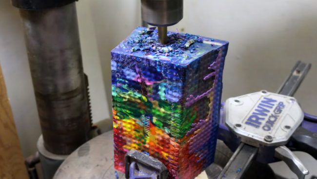 Then, using his drill press, Brown bore out the vase's opening.