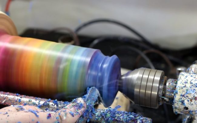 Turning the block on a wood lathe, the crafter finally began shaping it into a vase.