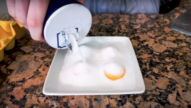 You can add spices or herbs to the salt, then cover the eggs completely with salt. Coating them fully is the most important thing. Then stick them in the fridge for 48 hours before brushing off the additional salt. 