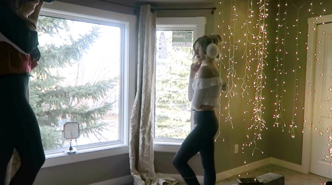 Rudnyk then positioned Brown in front of the hanging lights and adjacent to the window, creating a contrast between the natural light coming in and the warm light inside.