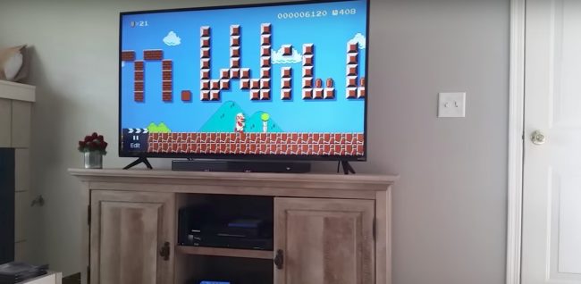 She's chugging along in the game, but then he points out that the letters in the sky spell "Pam." She laughs and giggles, asking him what he's done. By the time she gets to "Will," it's pretty clear what's happening, but she's still in disbelief.