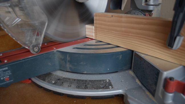 Using a miter saw, he first cut 25 small blocks out of a pine board.