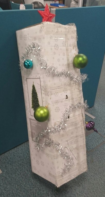 "No one at work has taken responsibility for decorating the Christmas tree; for the last week it has been propped up in its box waiting. Today, I stepped up to the plate."