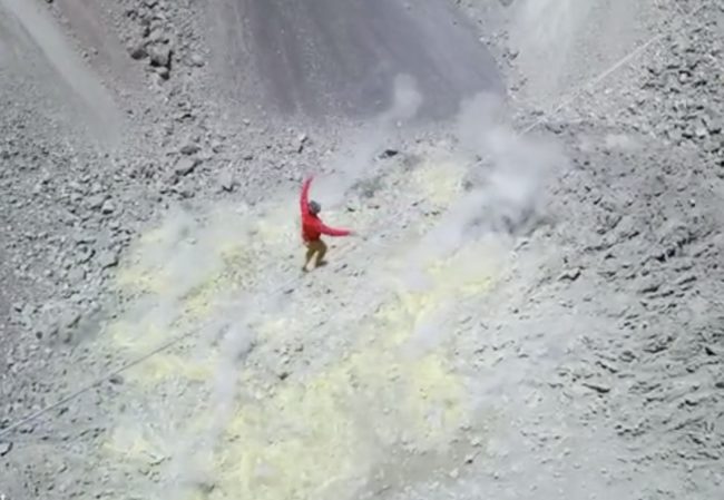 One wrong step and he would nosedive straight into the volcano's active center.
