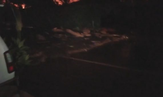 As the the wall of mud and debris made its way down the street, Farrell yelled frantically at another driver to turn around and flee.