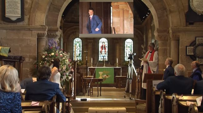 Vicky was shocked, to say the least -- that is, until she saw her husband-to-be on the projector screen and realized it was all part of an elaborate prank the vicar was in on.