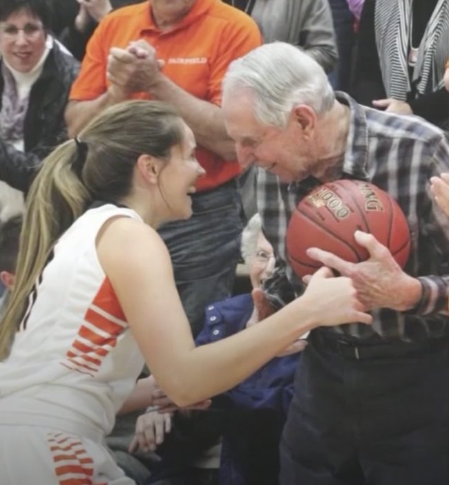 After scoring the career-defining basket, Buch couldn't help but run the prized ball over to her grandfather to thank him for all the support and advice over the years.