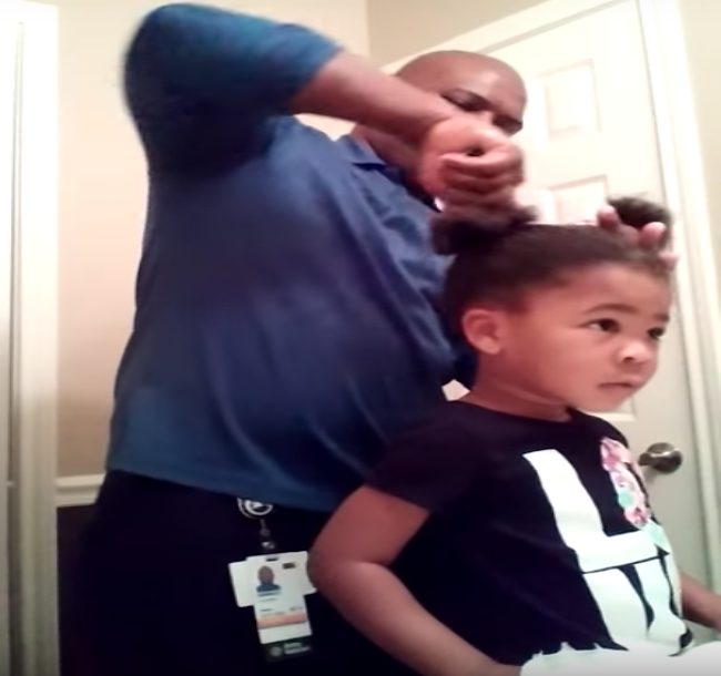 He asks his three year-old daughter what to do next, and she tells him to add more grease. Then she encourages him, saying he's doing a "good job." 